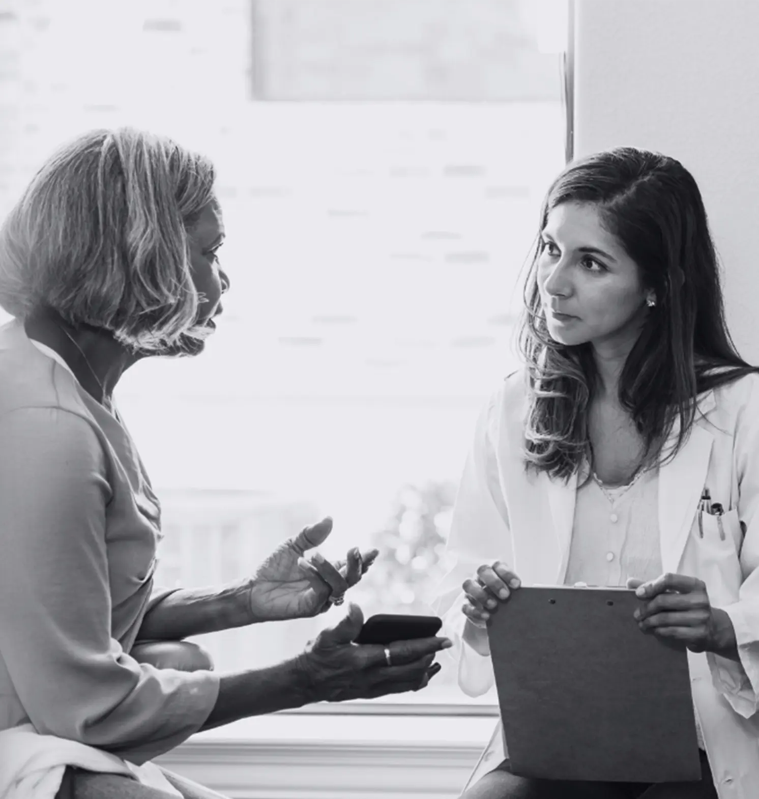 a patient talking to her doctor